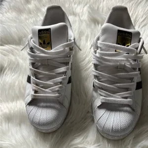 Adidas White and Black Superstar Sneakers